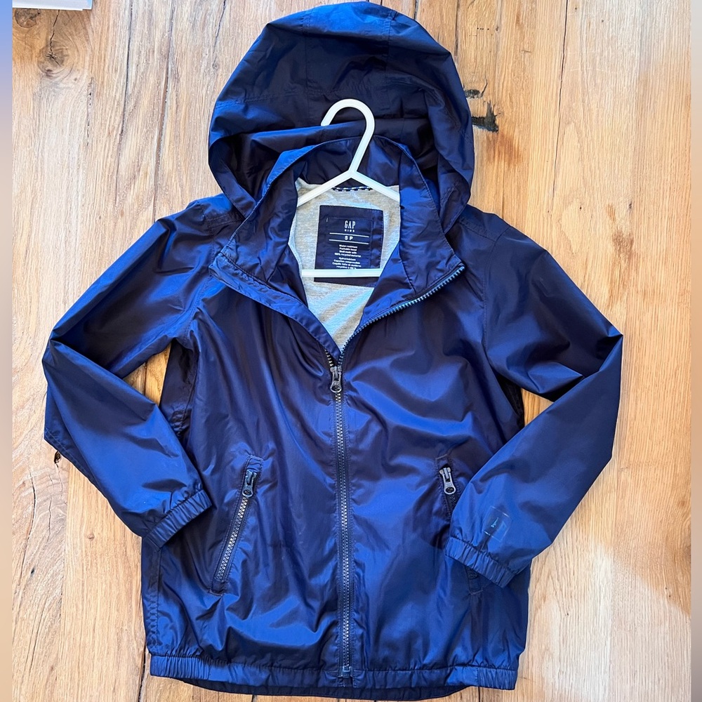 GAP. Size S (boys). Navy Blue Windbreaker (with fold away hood). Mint condition.